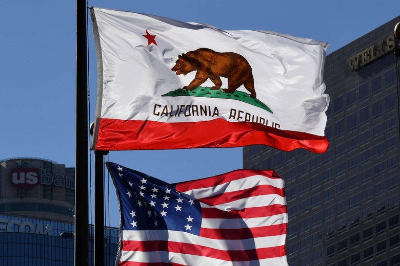 The California State flag flies beside a sign for its sister city Split outside City Hall, in Los Angeles, California on January 27, 2017.
A campaign by Californians to secede from the rest of the country over Donald Trump's election is gaining steam with suporters given the green light to start collecting signatures for the measure to be put to a vote.
/ AFP / Mark RALSTON (Photo credit should read MARK RALSTON/AFP/Getty Images)